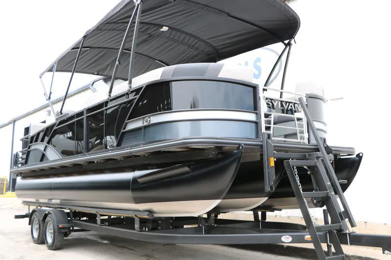 Slide: The Image of 2026 Sylvan L3 RLZ Tri Toon pontoon boat on trailer. - 9
