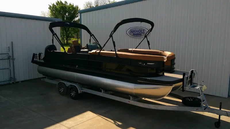 Slide: The Image of Bennington M 26 pontoon boat 2026 on trailer at Nichols Marine. - 3
