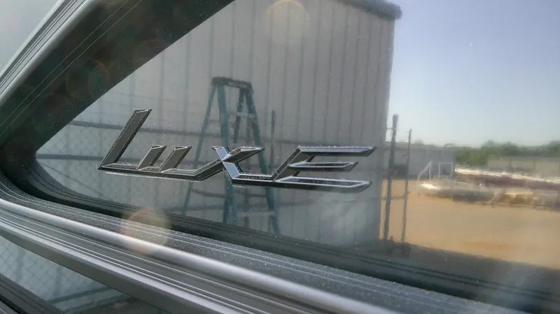 Slide: The Image of Bennington M 26 2026 with Luxe emblem, reflected in window. - 5