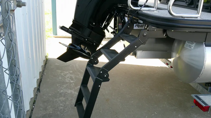 Slide: The Image of Bennington M 26 boat with foldable ladder, model year 2026. - 6