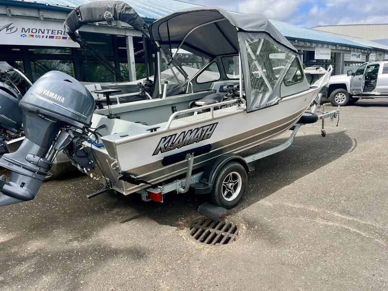 Slide: The Image of 2024 Klamath 18 OPW boat with Yamaha outboard motor. - 2