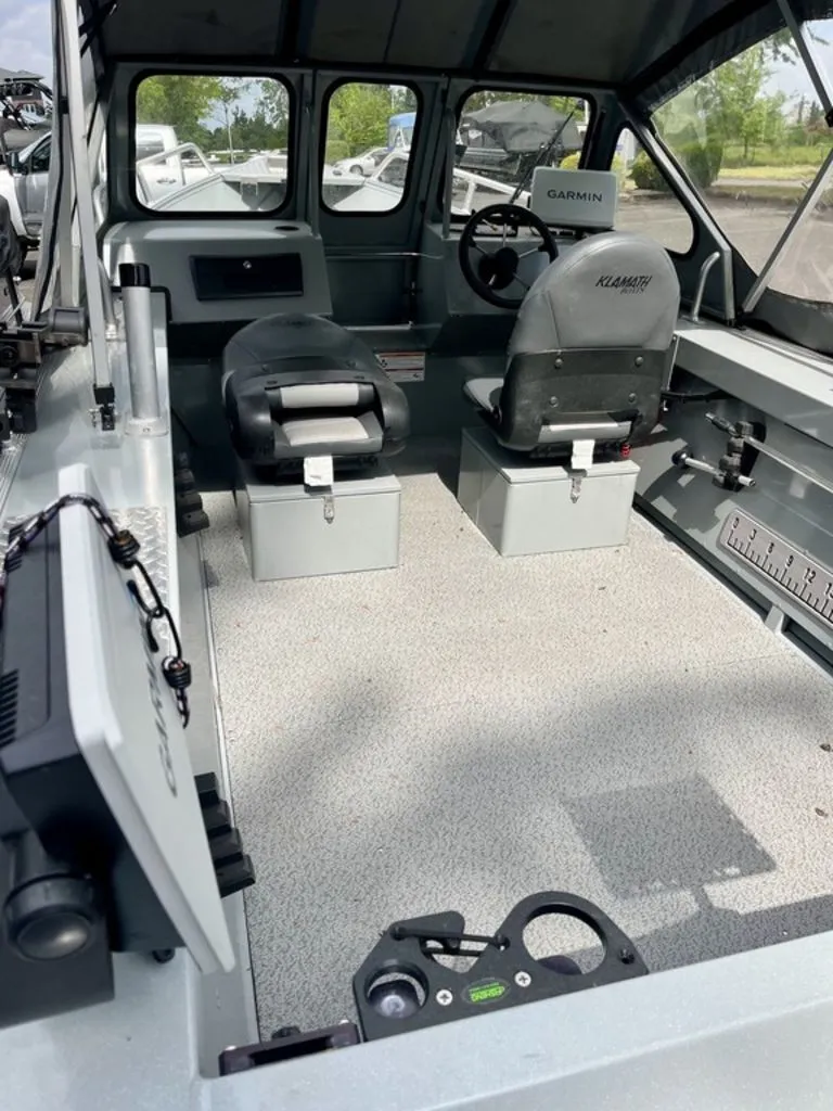 Slide: The Image of Interior of 2024 Klamath 18 OPW boat with Garmin controls. - 3