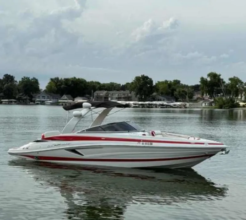 The Image of 2023 Crownline 280 SS boat on a calm lake. - 0