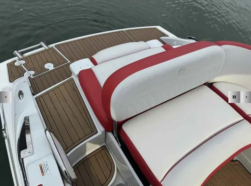 Slide: The Image of Crownline 280 SS 2023 boat with stylish seating and wood flooring. - 13