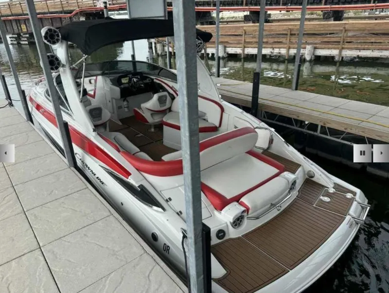 Slide: The Image of 2023 Crownline 280 SS boat docked, featuring luxurious design. - 5