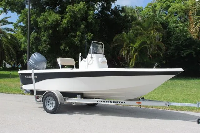 The Image of 2016 NauticStar 1810 boat on trailer, side view. - 1