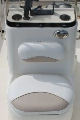 Slide: The Image of NauticStar 1810 2016 boat console with seat and cup holders. - 11