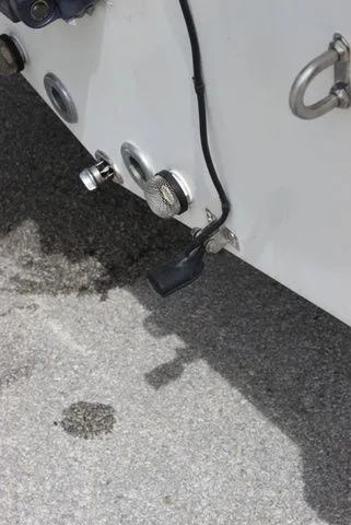 Slide: The Image of Rear view of a 2016 NauticStar 1810 boat with cable connections. - 16