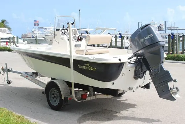 Slide: The Image of 2016 NauticStar 1810 boat with Yamaha outboard motor at dock. - 6