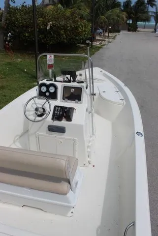 Slide: The Image of 2016 NauticStar 1810 boat with helm console, parked on road. - 8