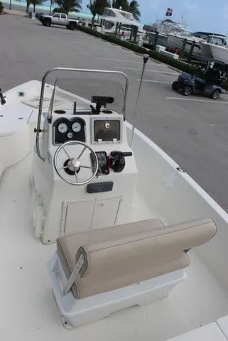 Slide: The Image of Interior view of a 2016 NauticStar 1810 boat with steering console. - 9