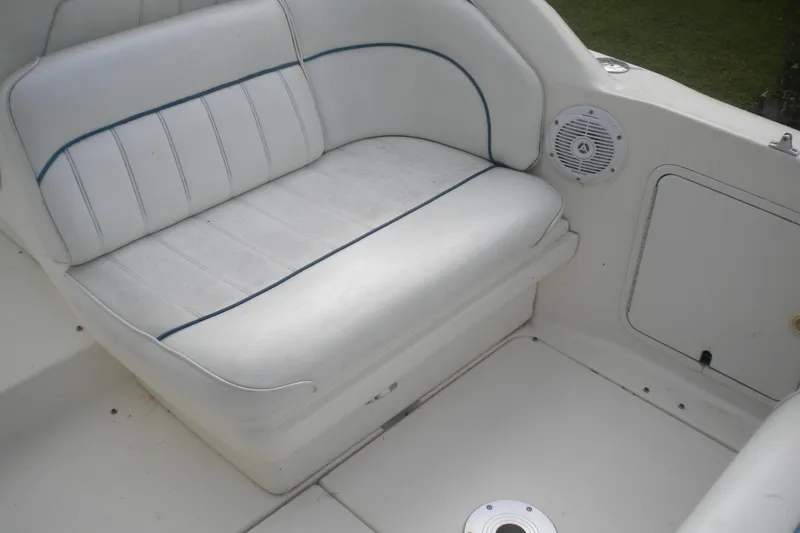 Slide: The Image of White seating area on a 1996 Sea Ray 270 Sundancer boat interior. - 10