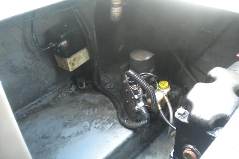 Slide: The Image of Engine compartment of a 1996 Sea Ray 270 Sundancer boat, showing mechanical components. - 21
