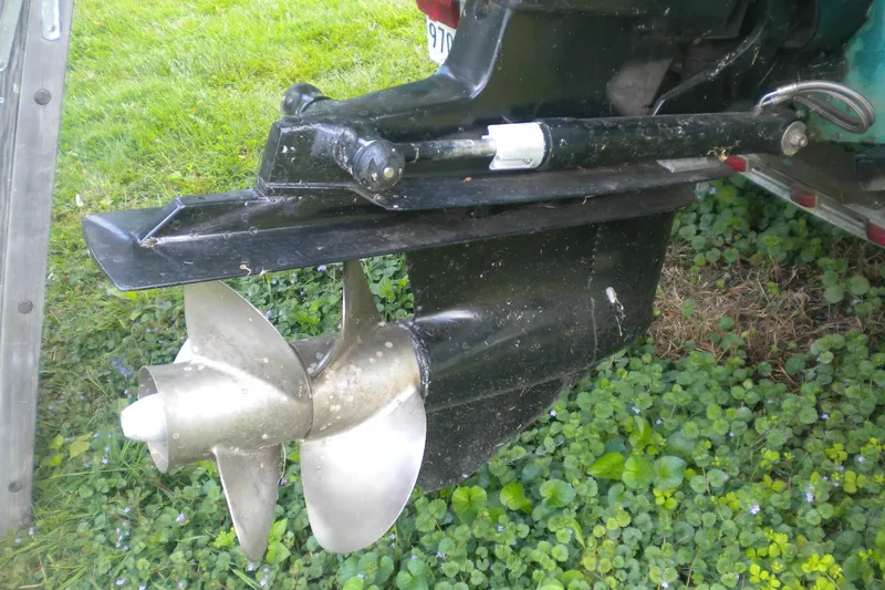 Slide: The Image of Propeller of a 1996 Sea Ray 270 Sundancer boat on grass. - 26