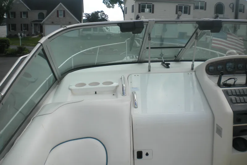 Slide: The Image of 1996 Sea Ray 270 Sundancer cockpit with windshield and control panel. - 6