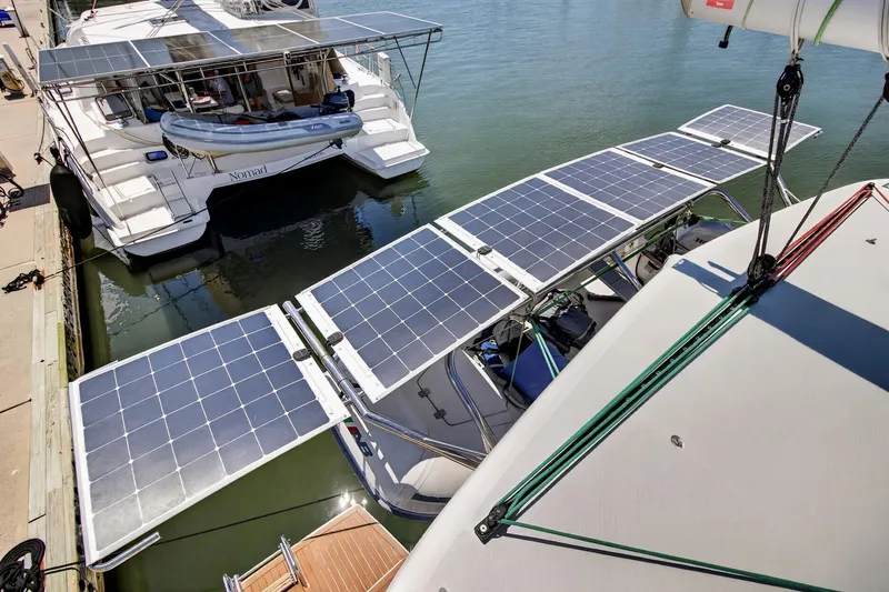 Slide: The Image of Catamaran with solar panels docked, Lagoon 42 model, 2018, eco-friendly marine technology. - 20