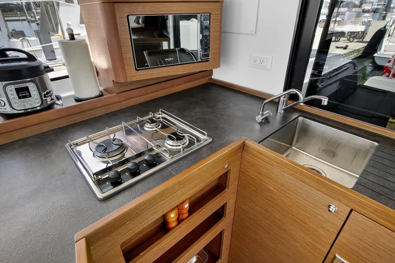 Slide: The Image of Modern kitchen in 2018 Lagoon 42 yacht with stove, sink, and appliances. - 33