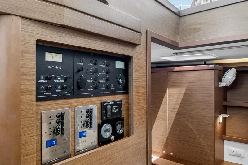 Slide: The Image of Control panel inside a 2018 Lagoon 42 yacht, featuring modern wooden interior design. - 38