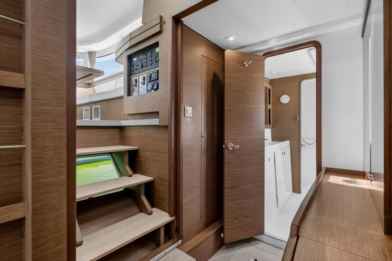 Slide: The Image of Interior of 2018 Lagoon 42 yacht featuring wooden finishes and modern amenities. - 39