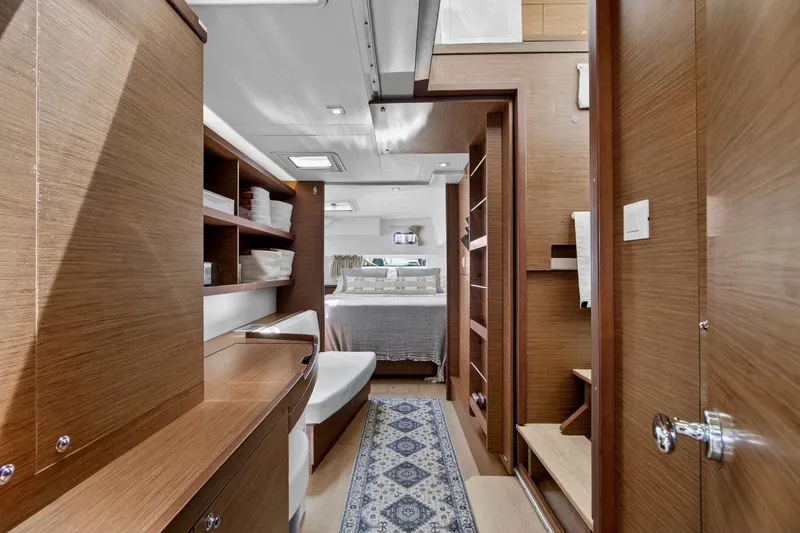 Slide: The Image of Luxurious interior of 2018 Lagoon 42 yacht featuring wood finishes and cozy bedroom. - 40