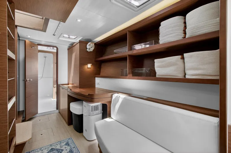 Slide: The Image of Interior of 2018 Lagoon 42 yacht with modern wood finish and cozy seating area. - 41