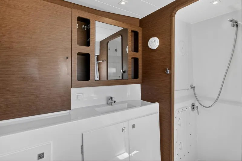 Slide: The Image of Modern bathroom interior on 2018 Lagoon 42 yacht, featuring wood accents and sleek fixtures. - 45
