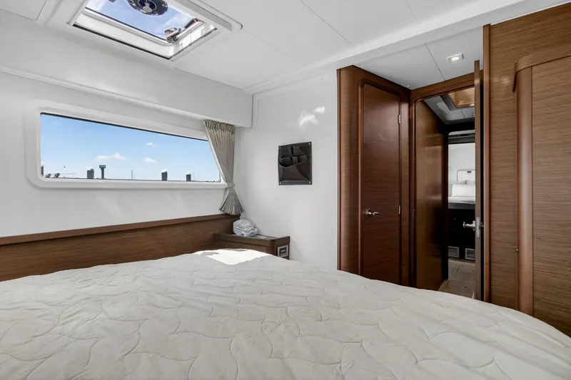 Slide: The Image of Luxurious interior cabin of a 2018 Lagoon 42 catamaran with modern wood finishes. - 49
