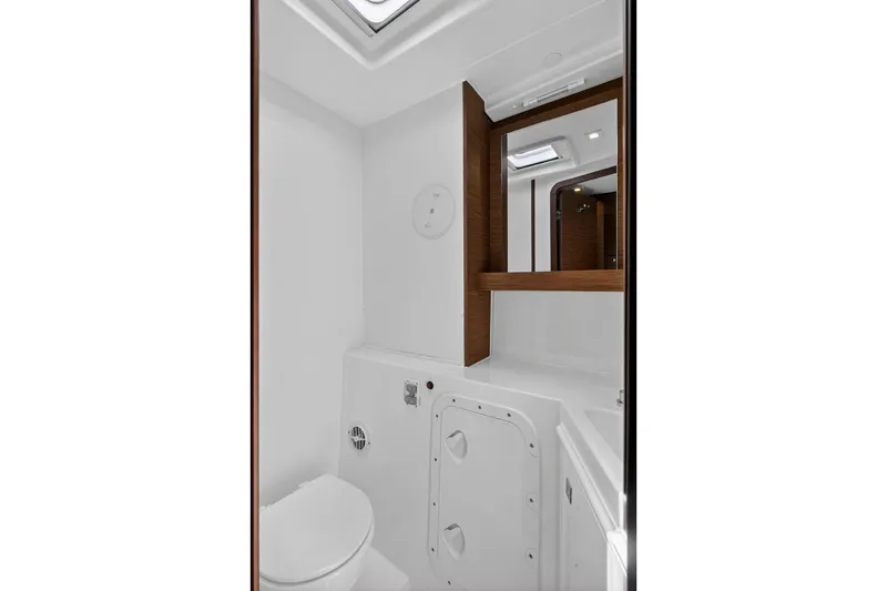 Slide: The Image of Bathroom interior of 2018 Lagoon 42 yacht, featuring modern fixtures and wood accents. - 53