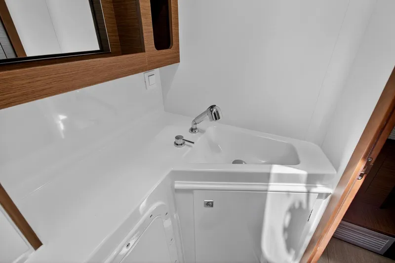 Slide: The Image of Modern bathroom sink in 2018 Lagoon 42 yacht, featuring sleek design and wooden accents. - 54