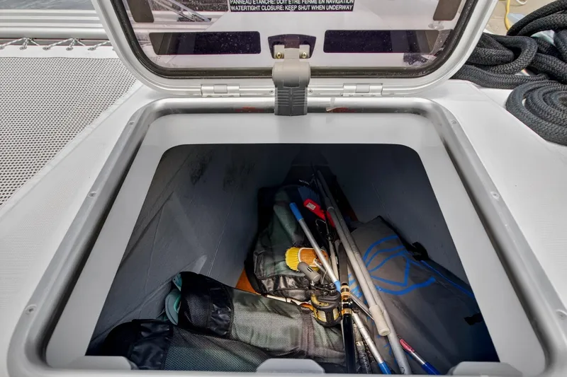 Slide: The Image of Storage compartment on a 2018 Lagoon 42 catamaran with fishing gear and equipment. - 59