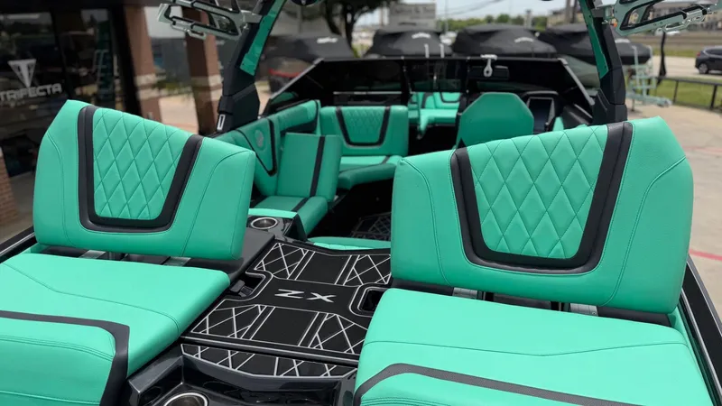 Slide: The Image of Interior of 2022 Tigé 23ZX with turquoise seating. - 10