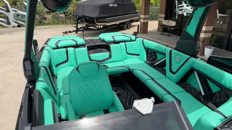 Slide: The Image of Interior of a 2022 Tigé 23ZX boat with turquoise seating. - 11