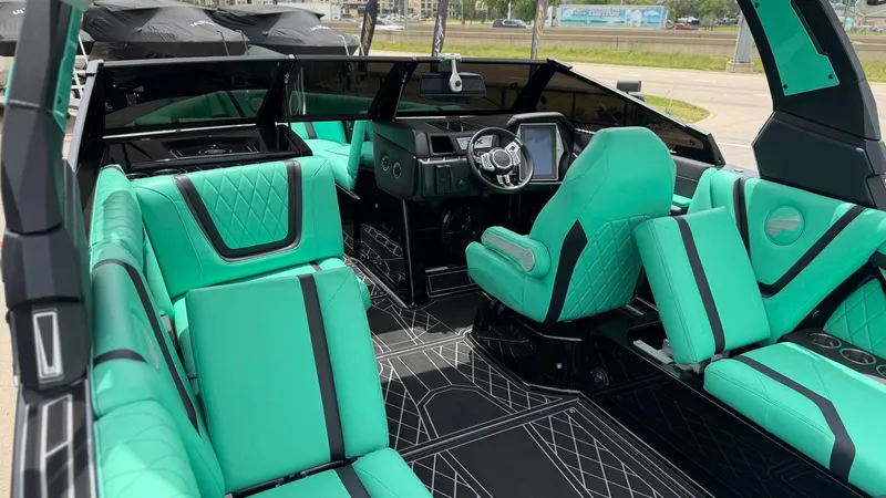 Slide: The Image of Interior of a 2022 Tigé 23ZX boat with turquoise seating. - 14