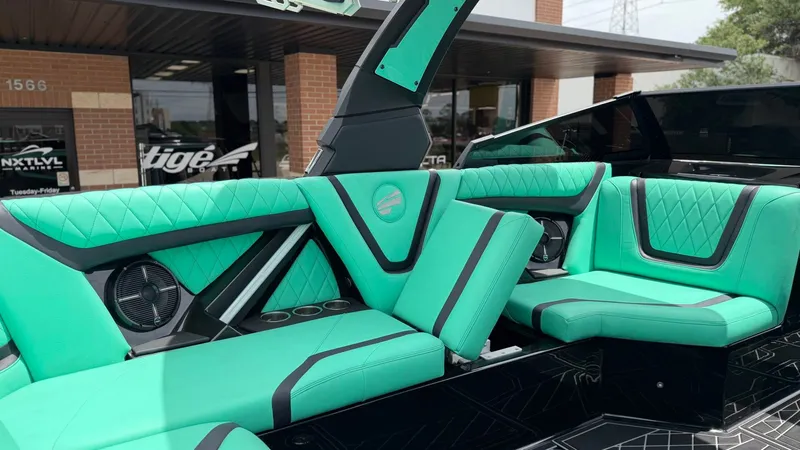 Slide: The Image of Interior of 2022 Tigé 23ZX with turquoise seating. - 15