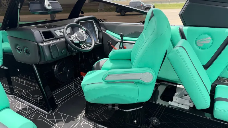 Slide: The Image of Interior of a 2022 Tigé 23ZX boat with turquoise seats. - 19