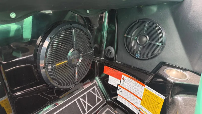 Slide: The Image of Speakers inside a 2022 Tigé 23ZX boat interior. - 21