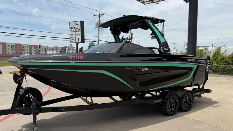 Slide: The Image of 2022 Tigé 23ZX boat on trailer at NXTLVL Marine. - 7