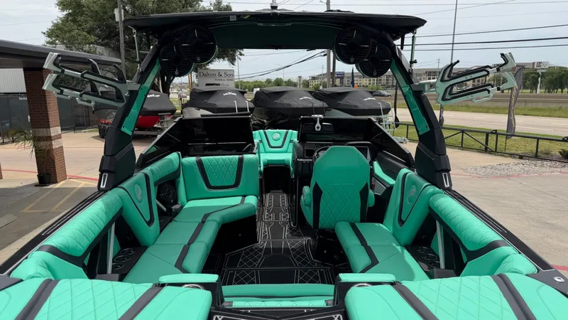 Slide: The Image of Interior of a 2022 Tigé 23ZX boat with turquoise seating. - 9