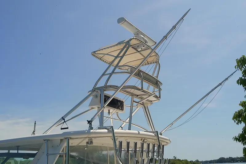 Slide: The Image of Tiara Yachts 4100 Open 2000 model with a tower against a clear blue sky. - 14