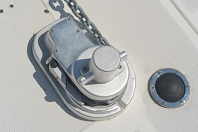 Slide: The Image of Anchor windlass on 2000 Tiara Yachts 4100 Open deck, with chain and deck fitting. - 17