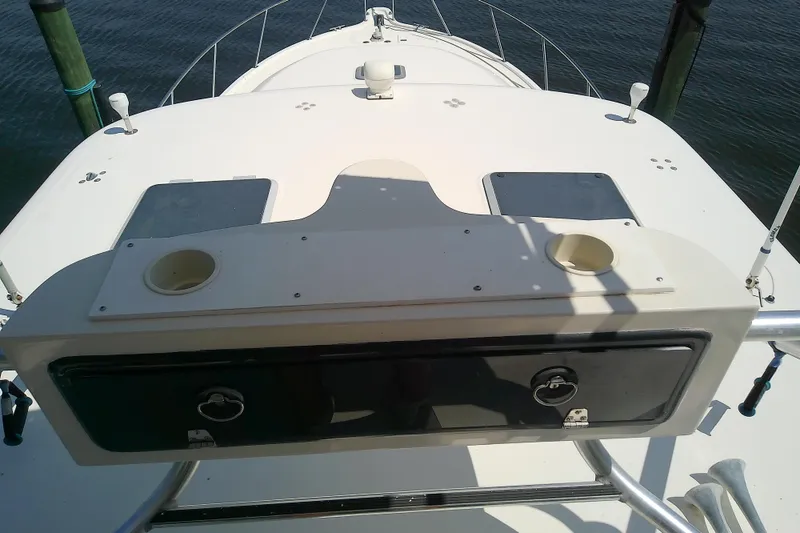 Slide: The Image of 2000 Tiara Yachts 4100 Open deck with rod holders and storage compartments. - 20