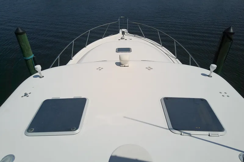 Slide: The Image of Bow view of 2000 Tiara Yachts 4100 Open on calm water. - 23
