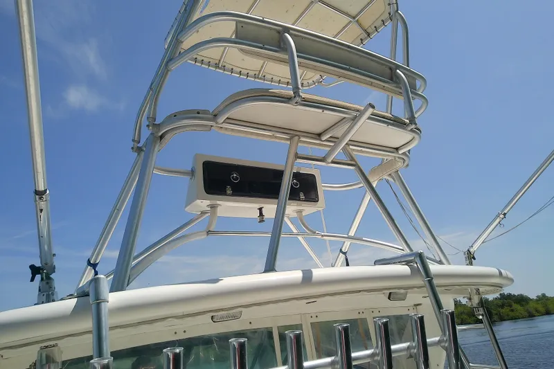 Slide: The Image of Tiara Yachts 4100 Open 2000 model with tower structure against blue sky. - 26