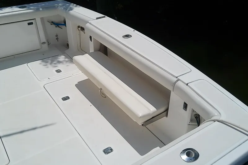 Slide: The Image of 2000 Tiara Yachts 4100 Open boat deck with foldable seating and storage compartments. - 28