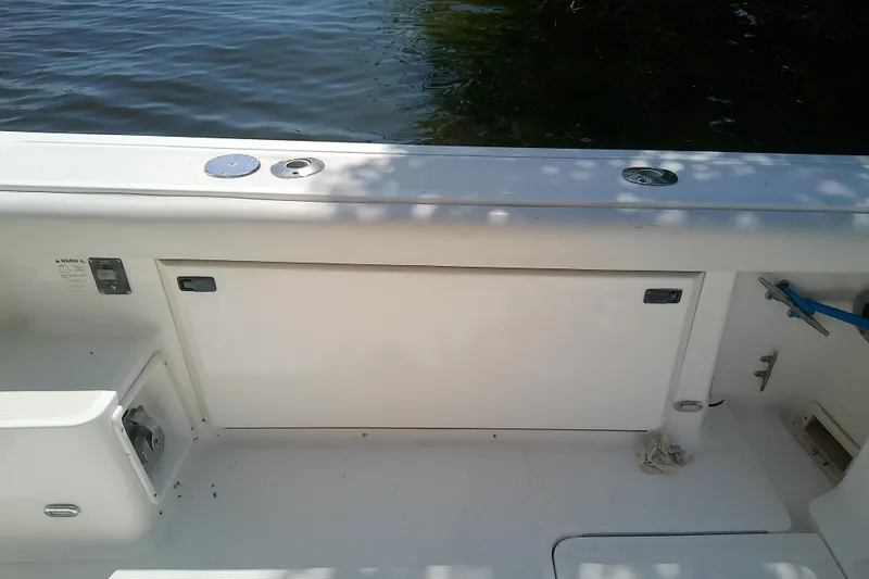 Slide: The Image of 2000 Tiara Yachts 4100 Open boat deck with storage compartments and water view. - 30
