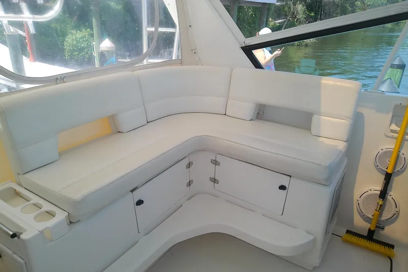 Slide: The Image of White seating area on a 2000 Tiara Yachts 4100 Open boat, with storage compartments. - 32