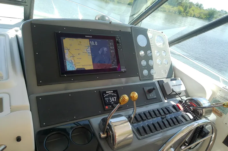 Slide: The Image of Cockpit of 2000 Tiara Yachts 4100 Open with navigation display and controls. - 37