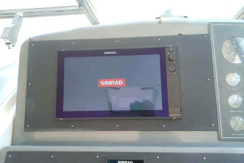 Slide: The Image of Simrad navigation display on 2000 Tiara Yachts 4100 Open dashboard. - 38