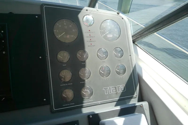 Slide: The Image of Instrument panel of a 2000 Tiara Yachts 4100 Open, featuring various gauges and controls. - 43