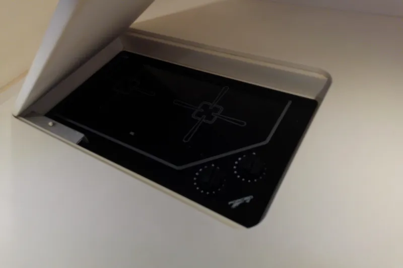 Slide: The Image of Built-in stovetop on 2000 Tiara Yachts 4100 Open, featuring dual burners and sleek design. - 51